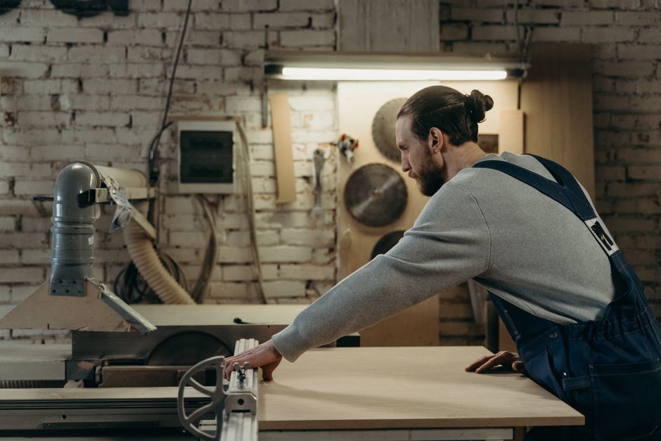 Skilled carpenter handcrafting custom furniture in a workshop