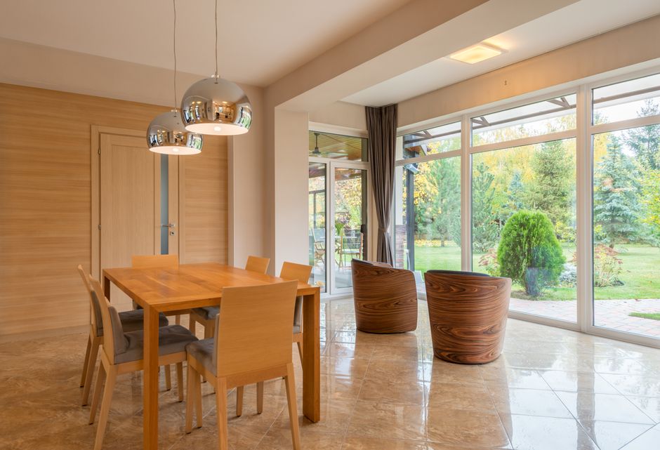 Large wooden dining table in a well-lit room
